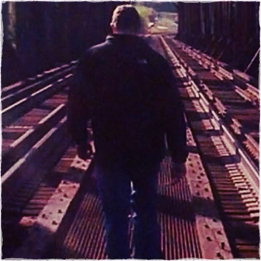 Pastor John B. Lowe II walking on a bridge
